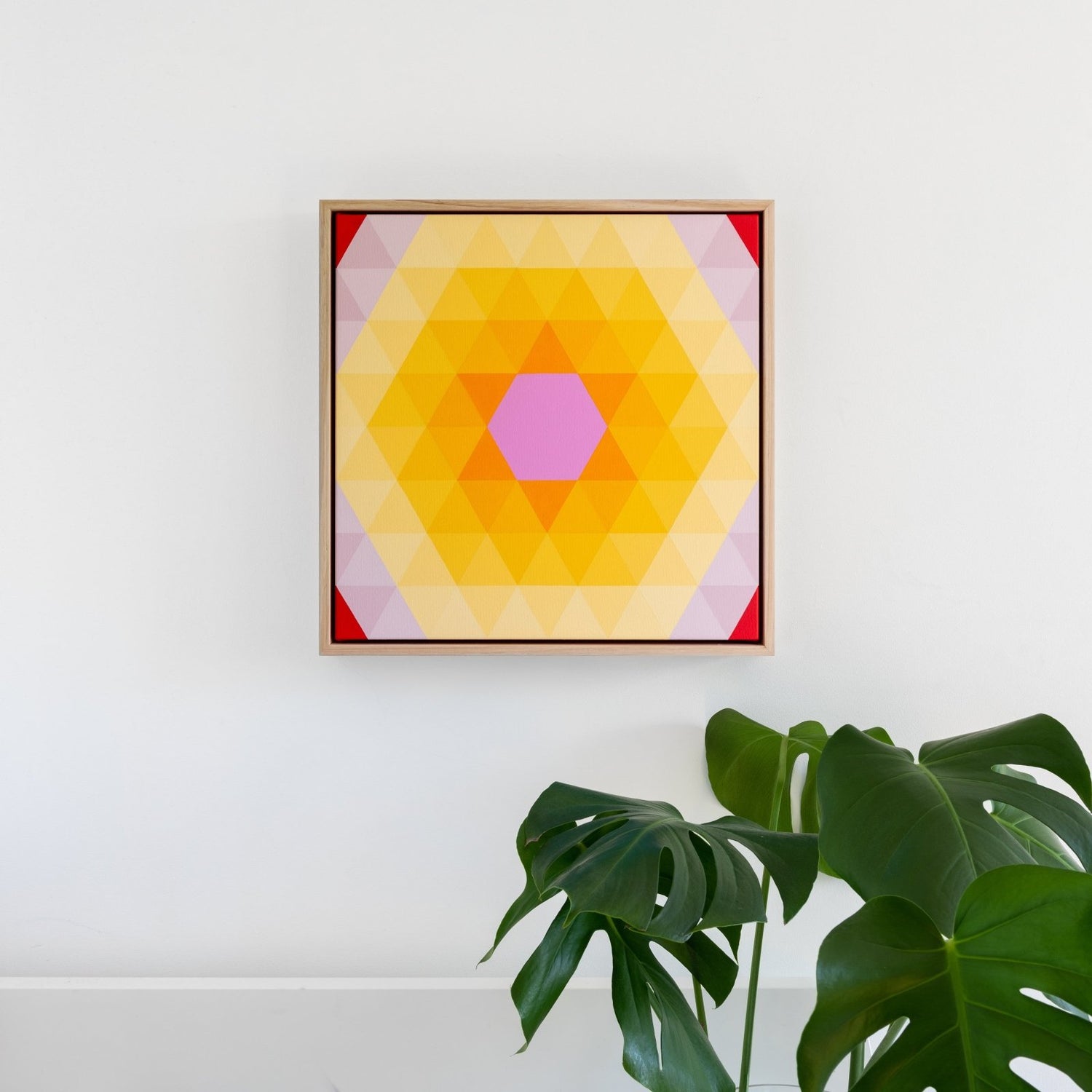 Geometric abstract art in isometric grid with a orange star in the centre radiating warm light